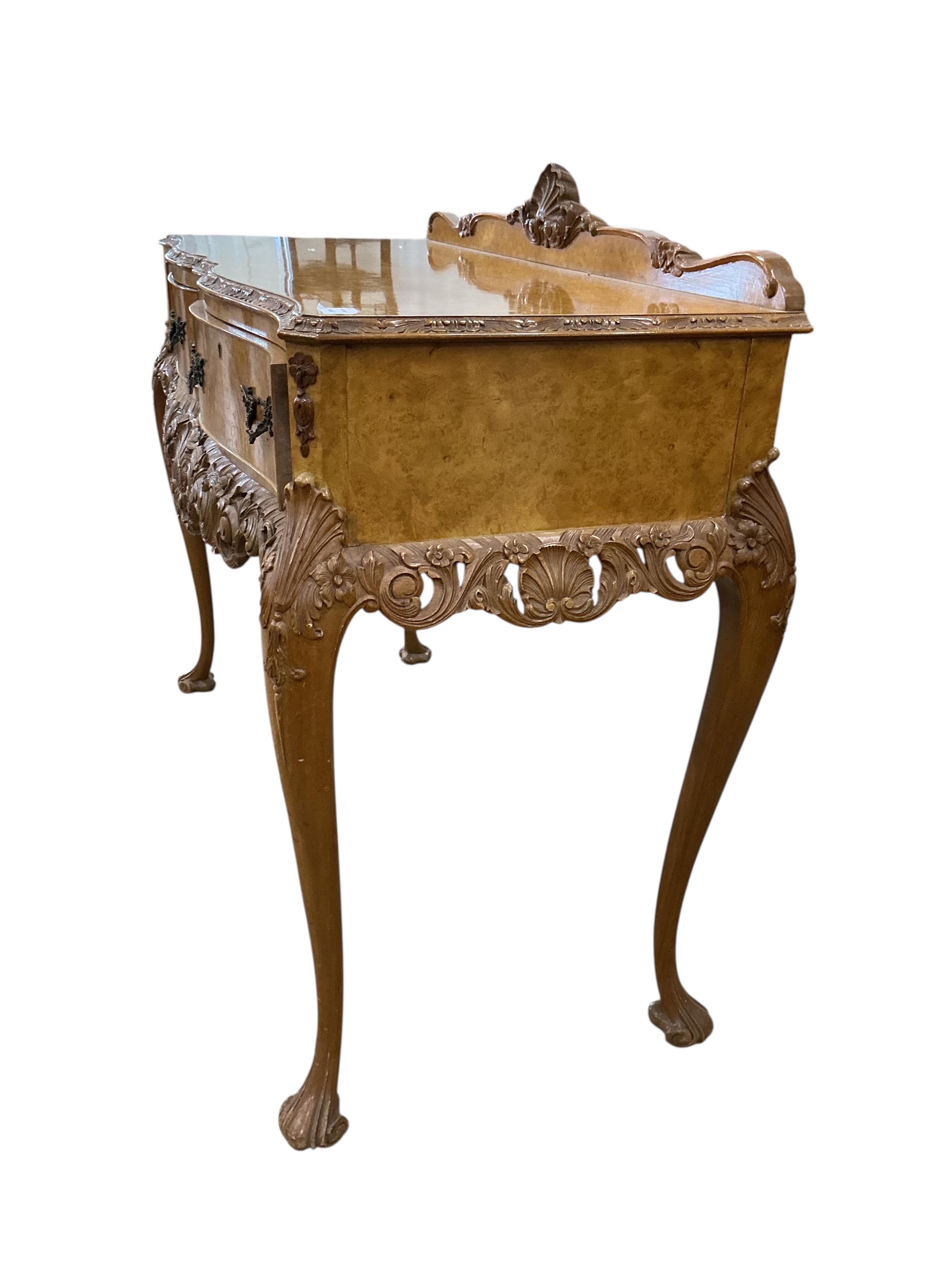 A Queen Anne Revival walnut two drawer serving table, width 120cm, depth 50cm, height 87cm